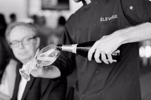 Man pouring wine into a cup