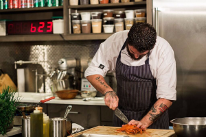 Man cutting a lobster