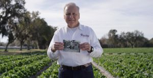 Gary holding photo of his father