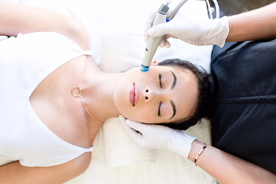 Woman getting facial treatment