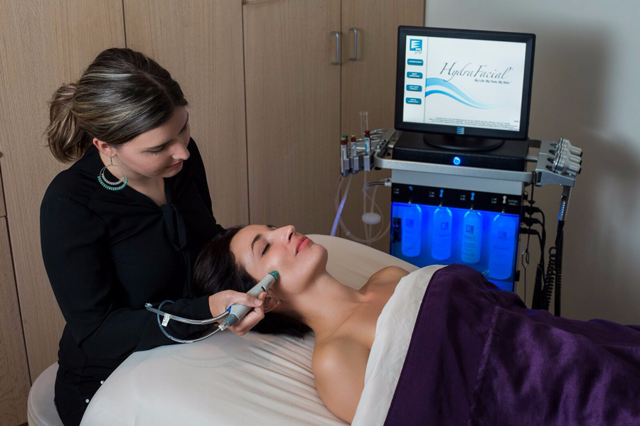 Woman getting facial treatment