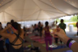 Someone holding a wine class in a yoga class